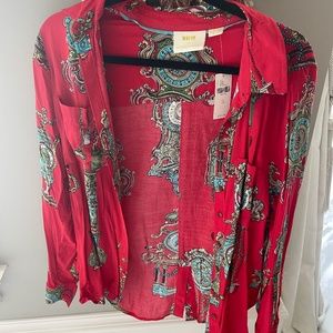 Anthropologie women's button up. Red with clock pattern.